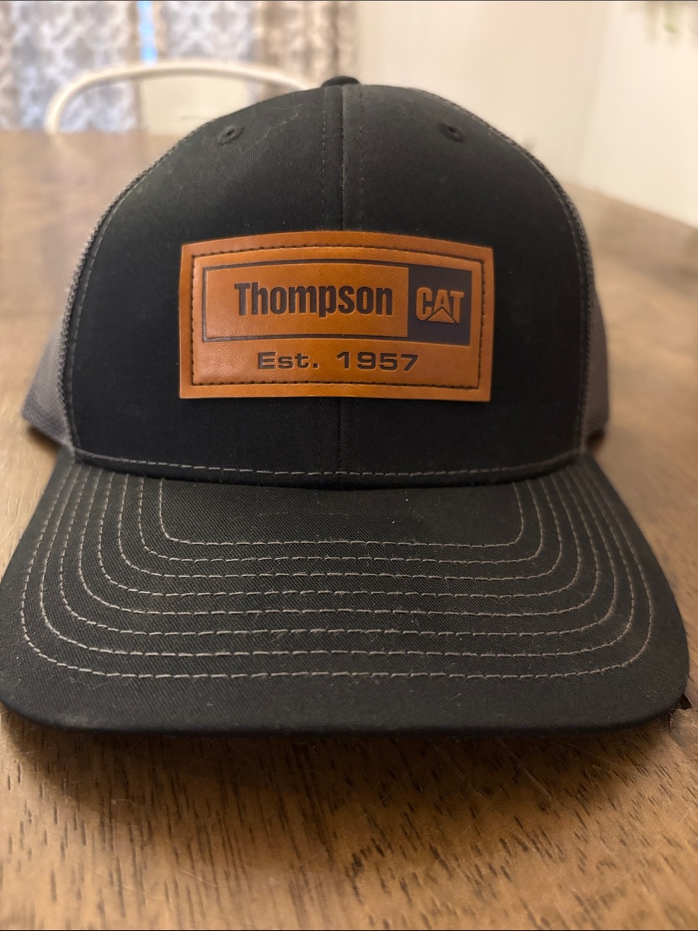 NWOT Thompson Black and Brown Leather Patch Trucker Hat